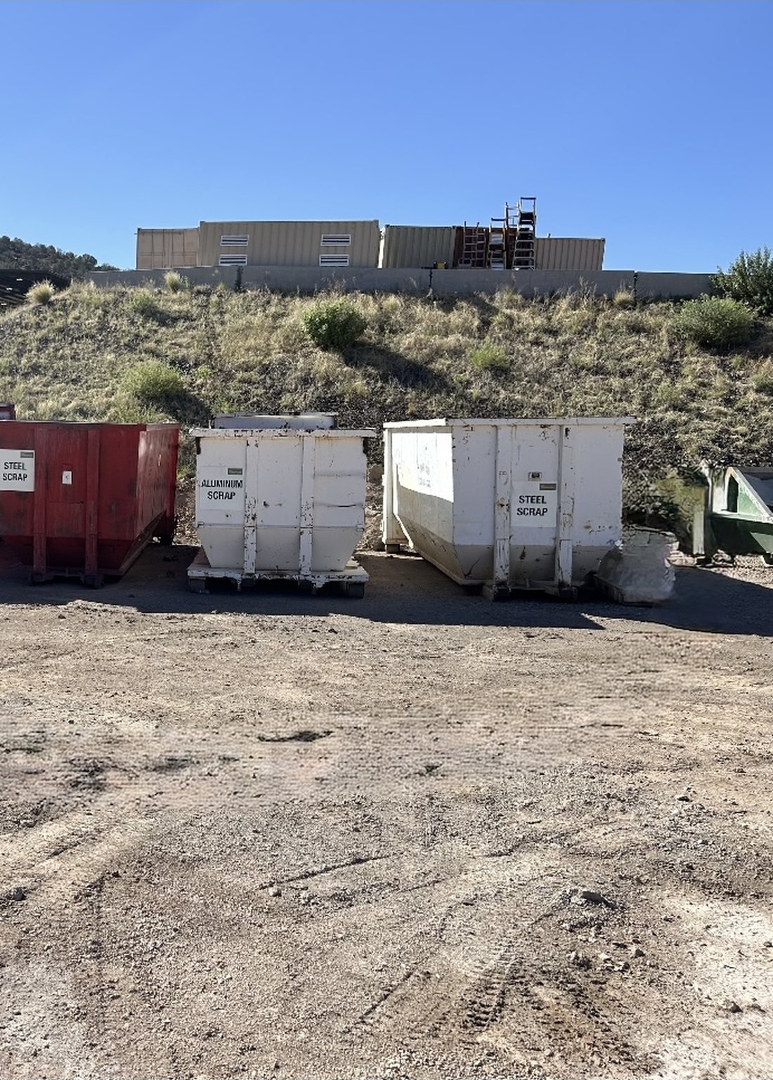 Roll-off dumpsters serving a warehouse and logistics facility in Southern Arizona