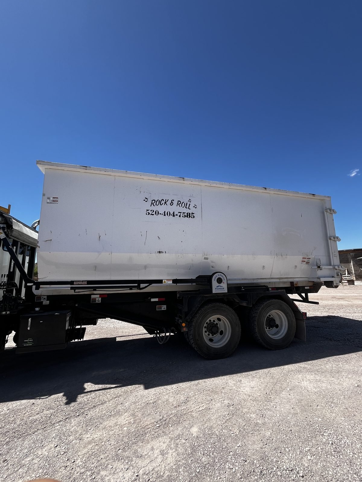 Rock & Roll Roll-Offs branded roll-off container — call 520-404-7585